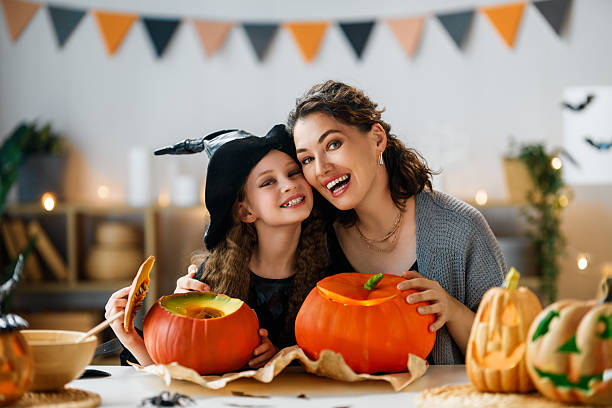 istock Happy family preparing for Halloween. 2230968005