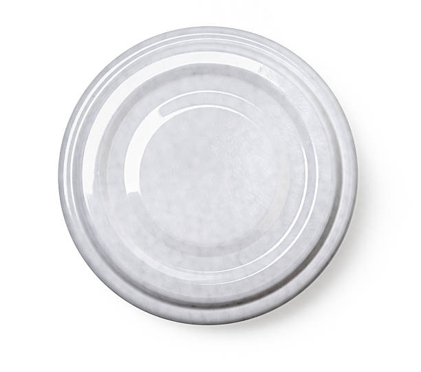 istock Grey metal lid from a jar resting on white background 2230970213