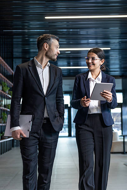 istock Two managers in the business center looking confident and discussing something 2230972722