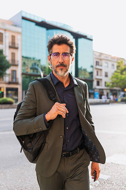 istock Confident businessman walking through city with purpose 2230979238