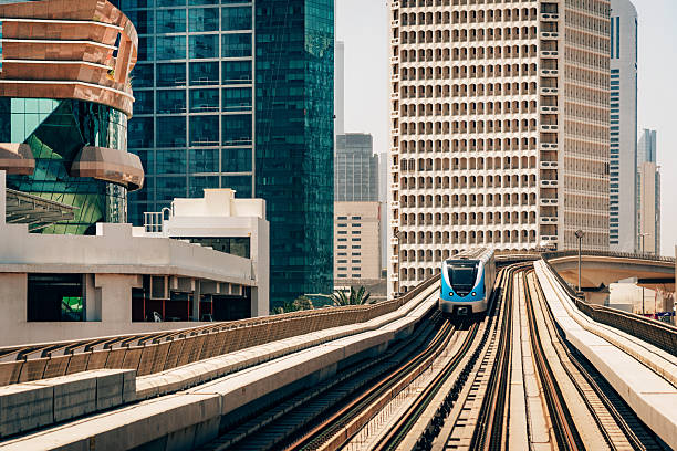 istock Modern Urban Train Traversing Through Skyline of Dubai Architecture 2230979605