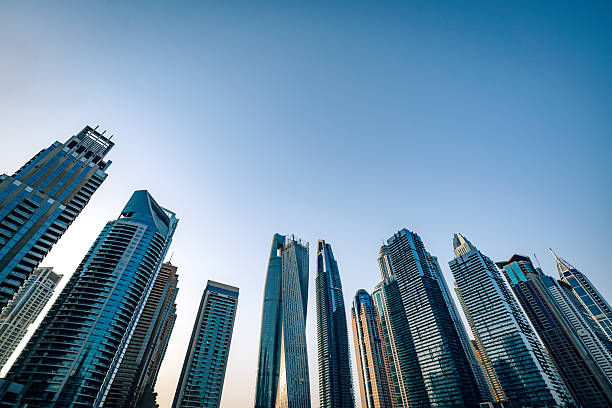 istock Modern Skyscrapers Along Dubai Marina Waterfront Under Clear Blue Sky 2230979919