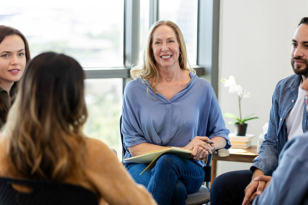 istock Group Therapy Session: Diverse Adults in Counseling 2230981467