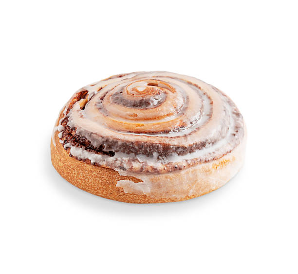 istock Side view of one delicious cinnamon roll glazed with sugar icing isolated on white background 2230983629
