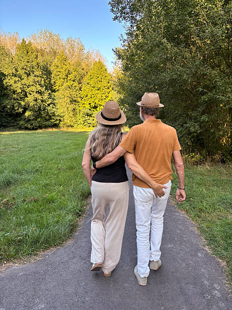 istock Close Senior Couple having a walk in the Park. 2230988709