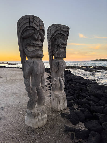 istock Tiki Statues on Beach at Sunset 2230990681