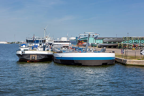 Port of Antwerp - moored industrial ships, barges