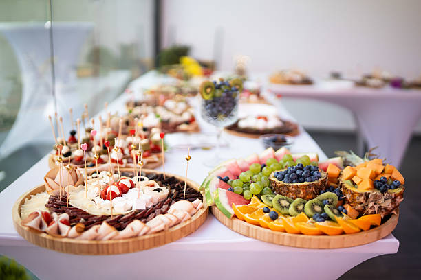 istock Luxury banquet table with assorted fresh fruit, cheese and deli platters 2230992246