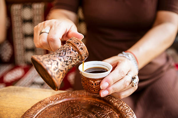 istock Female enjoys in Turkish coffee in sidewalk cafe 2230992351