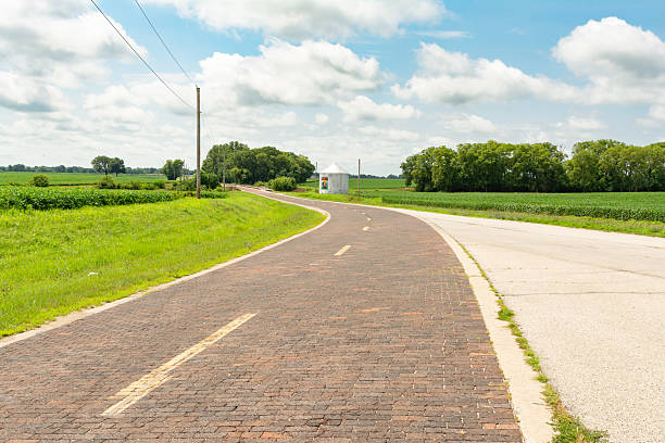 The historic Original Route 66 Brick Road on a sunny Summer afternoon.  Auburn, Illinois, USA.