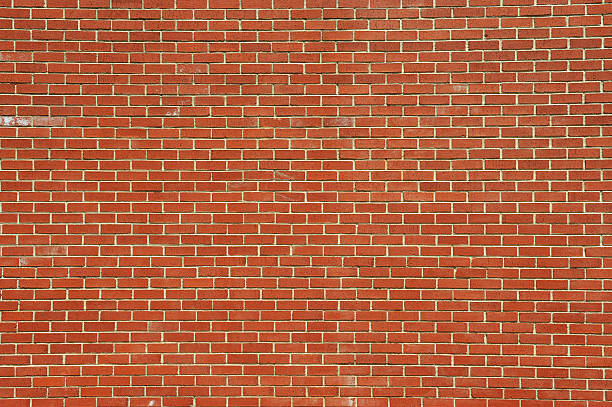 istock facade view of old red brick wall background 2231000135