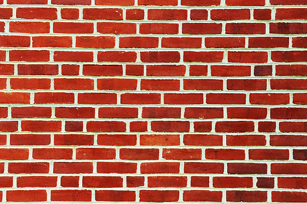 istock facade view of old red brick wall background 2231000149