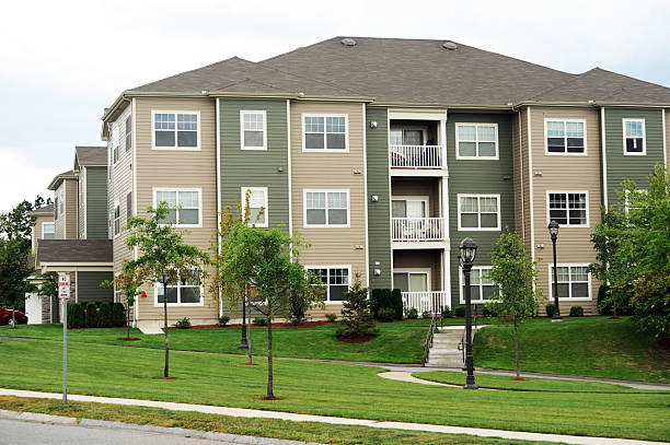 istock modern apartment building exterior with green lawn 2231000153