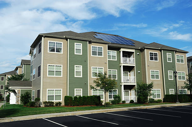 istock modern apartment buildings with solar panel on roof 2231000216