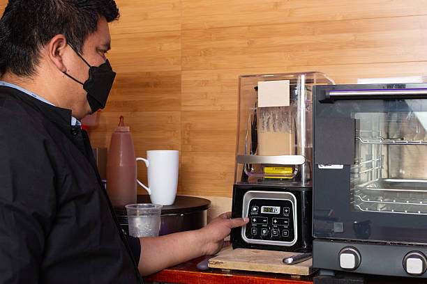 istock coffee barista mixing ingredients for frappe preparation 2231004792