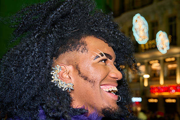 istock Young drag queen smiling with christmas lights in the background 2231006945