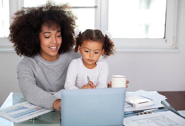 istock Young mother working and spending time with her daughter 2231016842