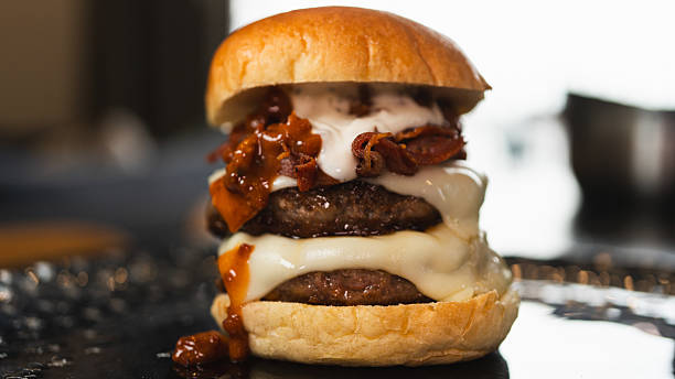 istock Juicy Gourmet Burger with Double Patty, Bacon, and Melted Cheese 2231018313