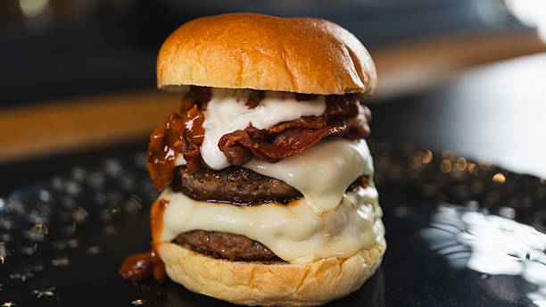 istock Juicy Gourmet Burger with Double Patty, Bacon, and Melted Cheese 2231018330