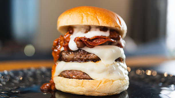 istock Juicy Gourmet Burger with Double Patty, Bacon, and Melted Cheese 2231018331