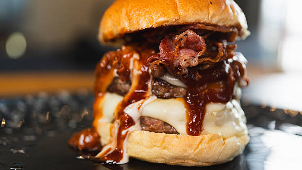 istock Juicy Gourmet Burger with Double Patty, Bacon, and Melted Cheese 2231018357