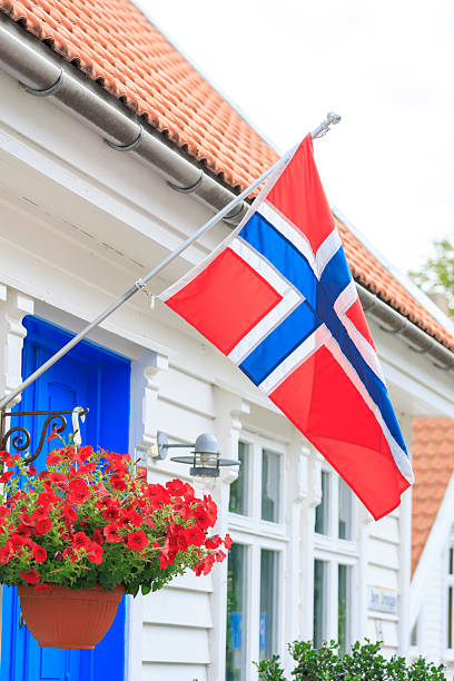 istock the Norwegian flag flying on a Stanvanger old town white house 2231018555