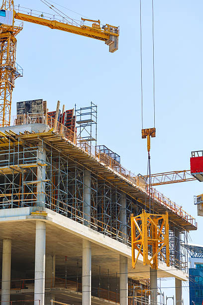 istock Building Under Construction with Cranes and Scaffolding 2231019823