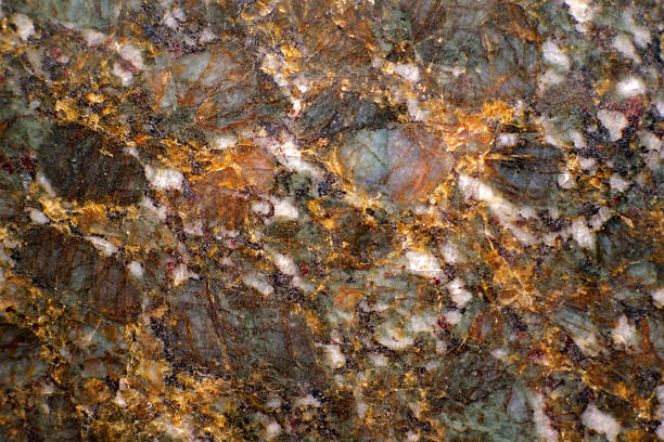 istock Close-up of natural granite stone surface showing multicolored mineral patterns. 2231020757