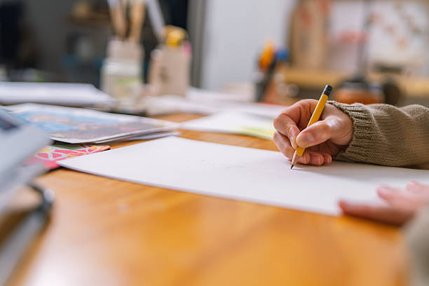 istock Graphic designer sketching new project in home studio 2231021227
