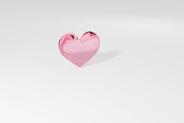 Pink glass heart on a white background