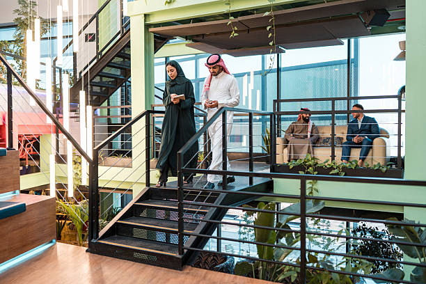 istock Professional Middle Eastern Business Colleagues Discussing Work in a Stylish Modern Office Space 2231023676