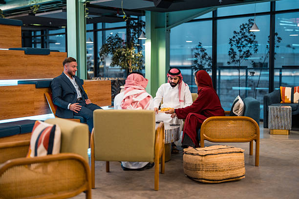 istock Professional Business Meeting Between Middle Eastern and Caucasian Partners in Modern Office Setting 2231023710