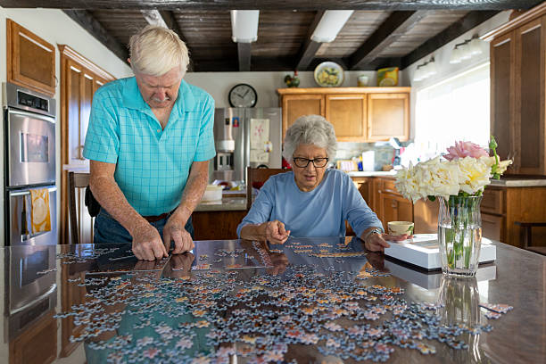 istock Senior Couple Working on a Puzzle 2231023857