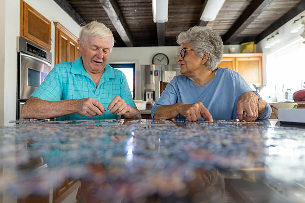 istock Senior Couple Working on a Puzzle 2231023868