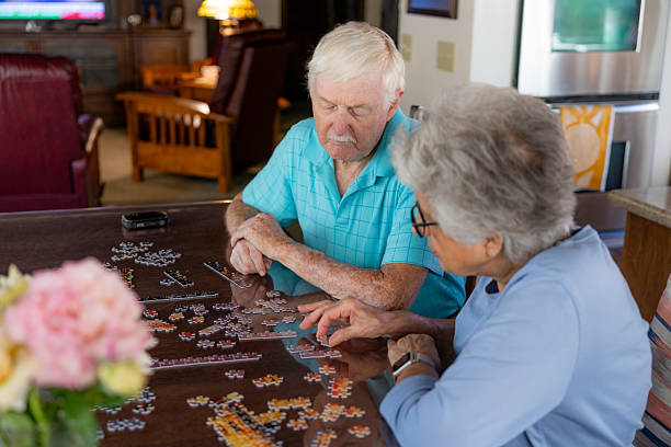 istock Senior Couple Working on a Puzzle 2231023890