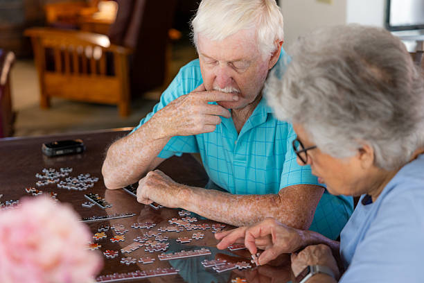 istock Senior Couple Working on a Puzzle 2231023895