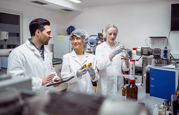istock Laboratory Scientists In White Coats Conducting Quality Control Tests In Modern Pharmaceutical Facility 2231025196