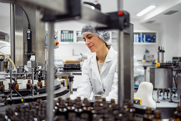istock Laboratory Worker In White Coat Operating Automated Production Line Equipment In Modern Facility 2231025204