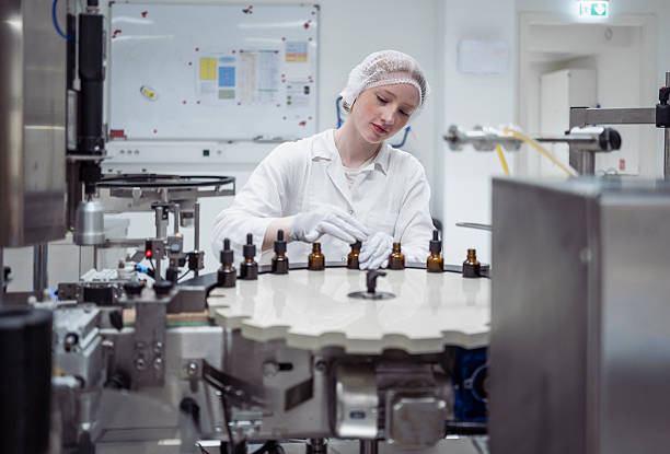 istock Caucasian Female Lab Worker Packaging Products in Sterile Indoor Laboratory Setting with Bright Lighting 2231025213