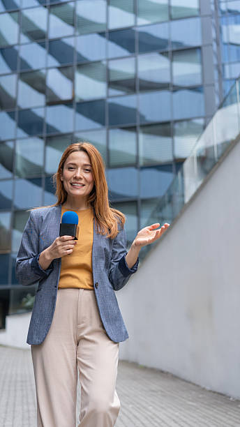 istock Urban setting female reporter engaging viewers with joy 2231027424
