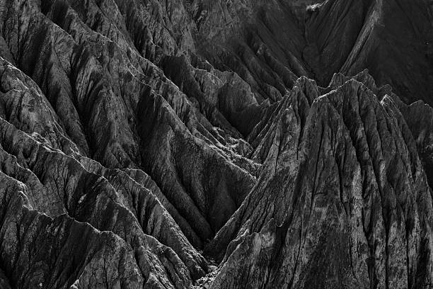 A close-up of the dark grey rocks taken with a telephoto lens
