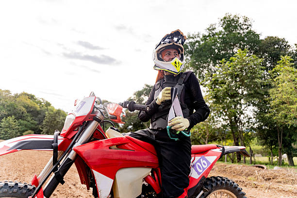 Female motocross rider getting ready on a track