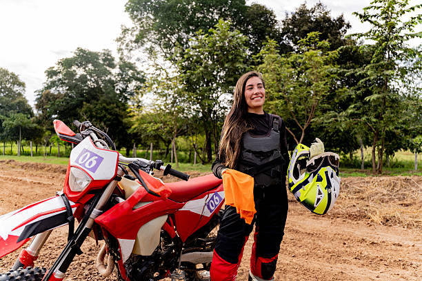 Female motocross rider getting ready on a track
