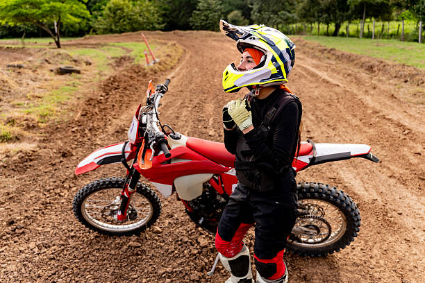 istock Female motocross rider getting ready on a track 2231028521