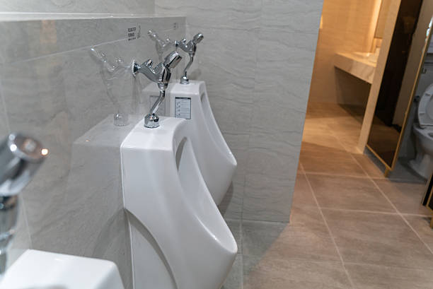 istock Clean Modern Bathroom Urinals in Row 2231030767