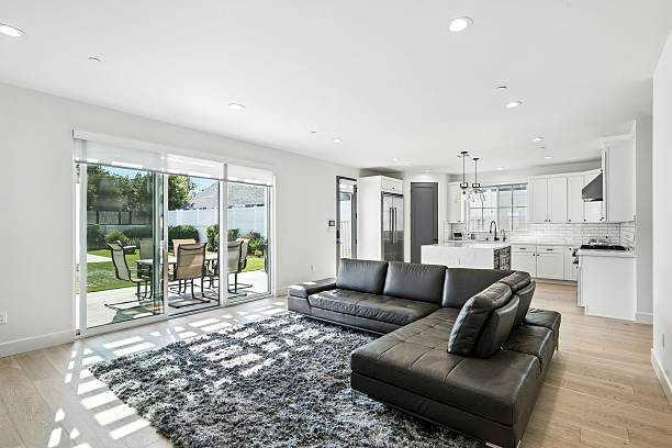 istock Modern open-plan living room with patio view. 2231033991