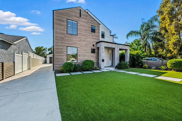 istock Modern Suburban House with Manicured Lawn 2231034018