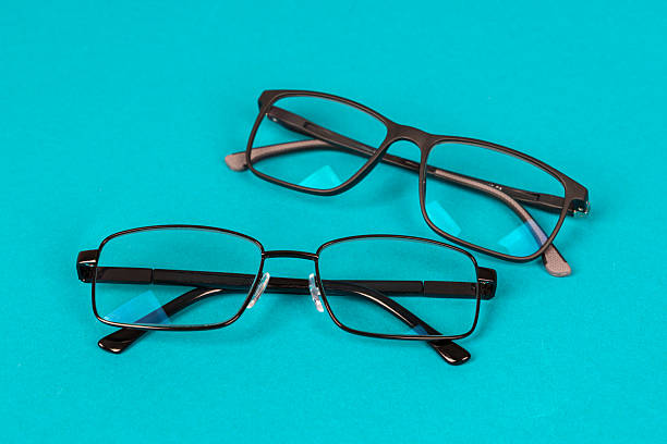 Modern Black Eyeglasses: Two Pairs with Different Frames (Metal & Plastic). Modern Eyewear Fashion, Vision Correction, Optical Accessories Concept for Retail, Lifestyle, and Healthcare Use