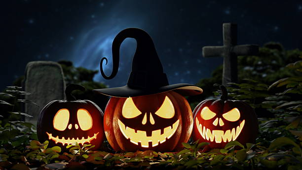 istock Three jack-o-lanterns with carved, grinning faces sit on the ground among leaves in a graveyard at night, illuminated with an eerie glow against a dark background. 3d render 2231054956