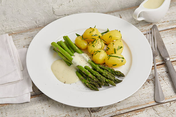 istock Green asparagus with boiled potatoes 2231061983